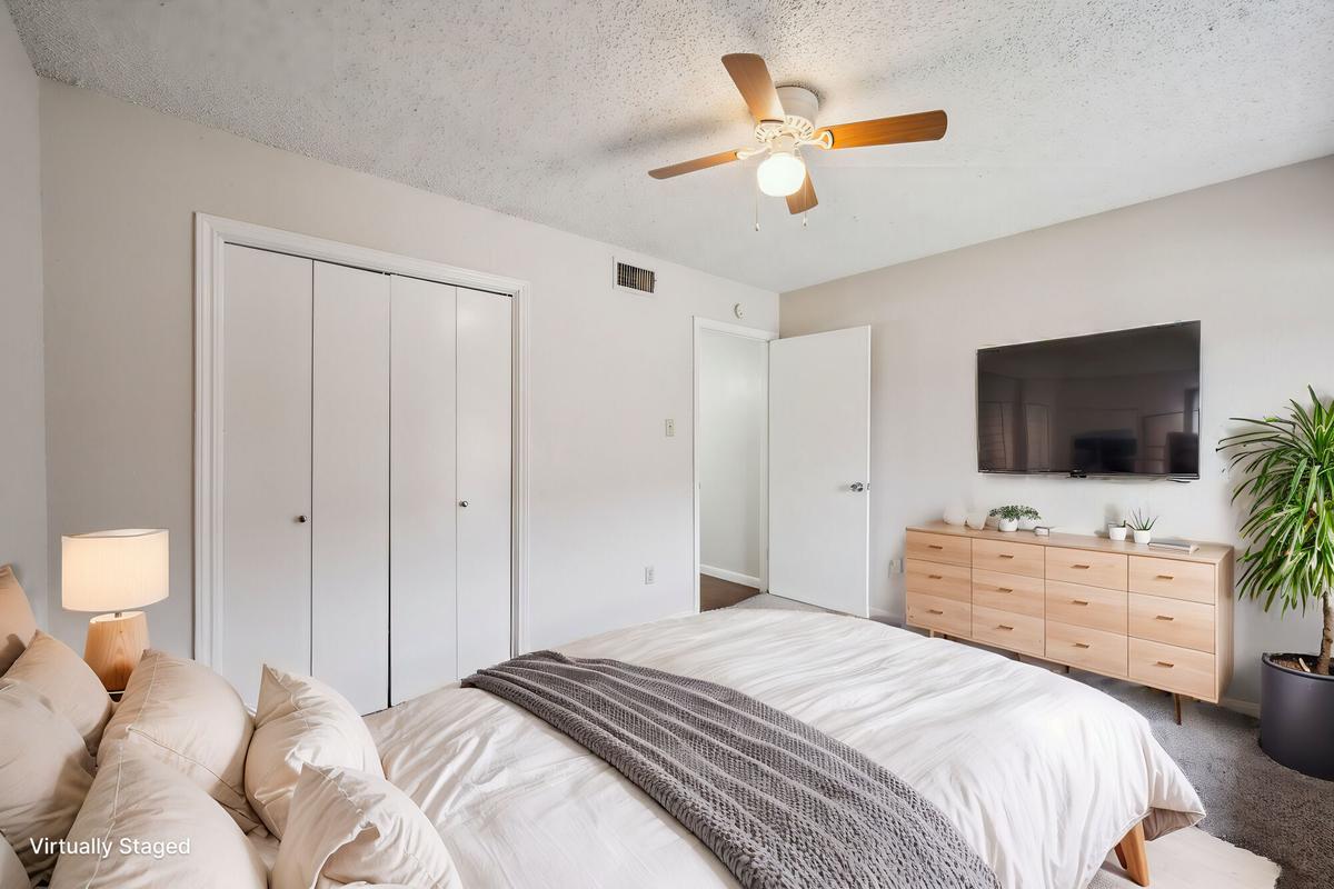 Spacious primary bedroom at Bay Colony Apartments