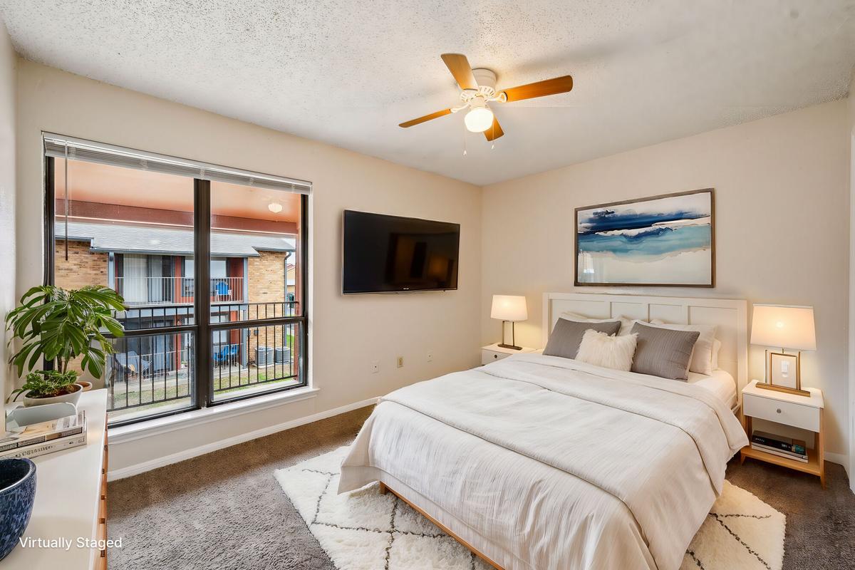 Primary bedroom with closet at Bay Colony Apartments