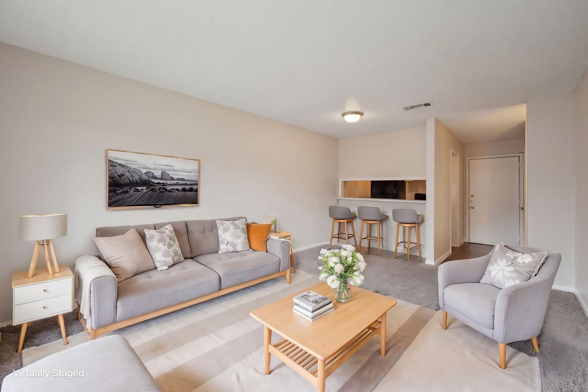 Living room with natural light at Bay Colony Apartments